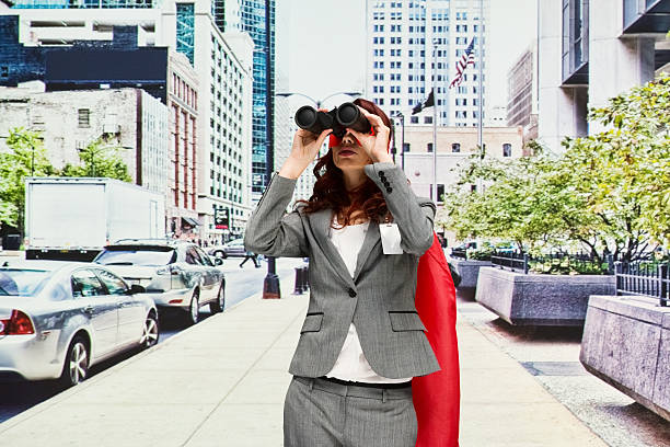 поиск супергероев с биноклем - chicago built structure business forecasting стоковые фото и изображения