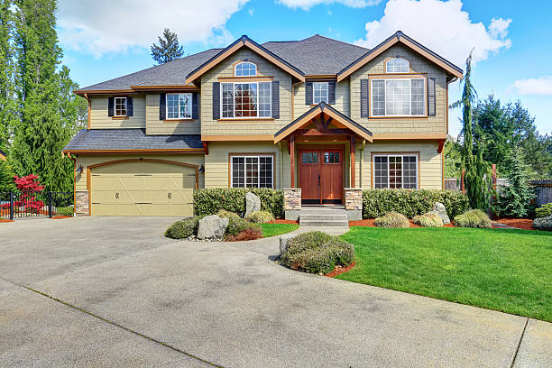 istock Luxurious home with well kept lawn and green exterior paint. 576930832
