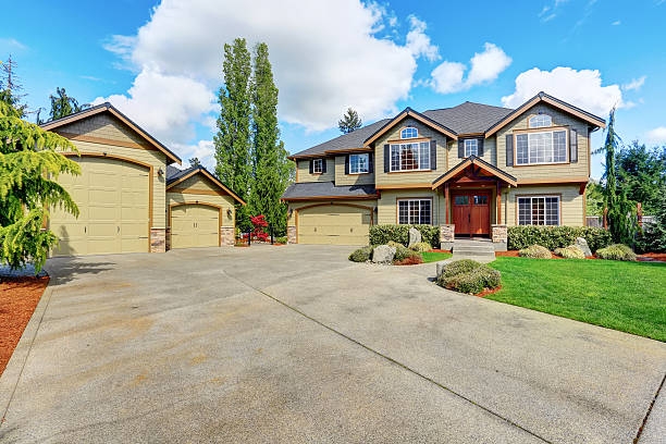 istock Luxurious home with well kept lawn and green exterior paint. 576930914