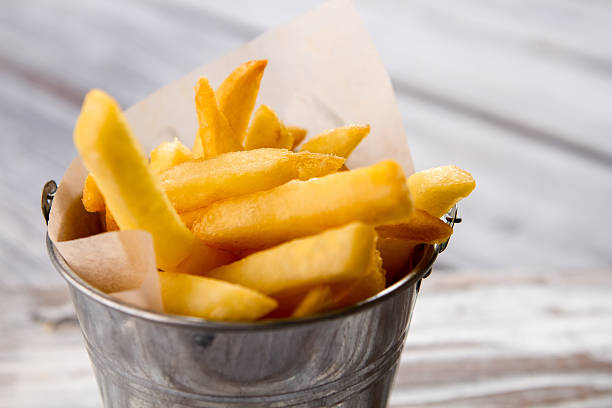 istock Bucket with yellow fries. 576931126