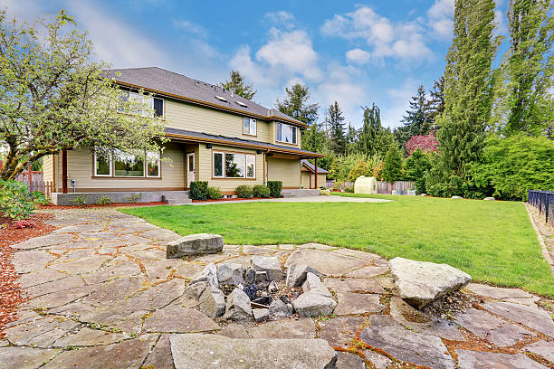 istock Exterior of luxury house with grass filled back yard 576931446