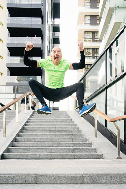 istock Cheerful Man Running And Jumping 576931564