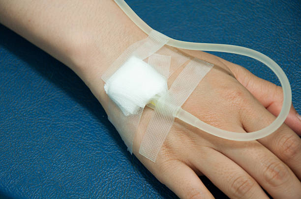 Close up of  iv drip in patient's hand