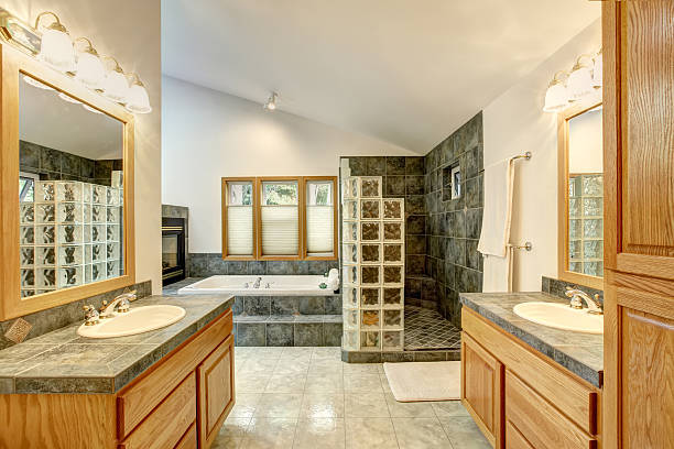 istock Master bathroom interior with tile flooring and modern cabinets. 576932274