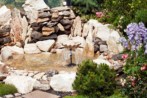 istock Stone fountain in the garden 576932716