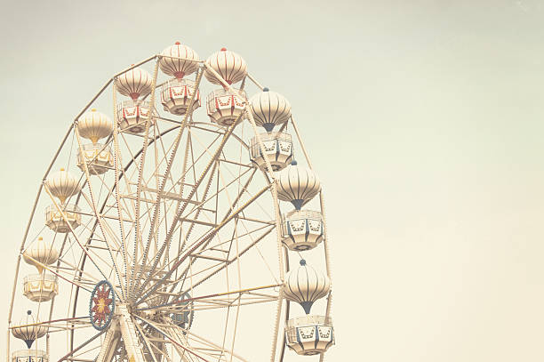 istock ferris wheel against blue sky 576933168