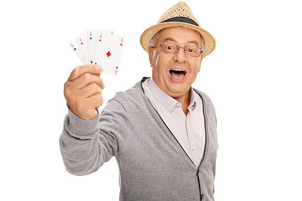 elderly man showing four aces - isolated holding letter people imagens e fotografias de stock