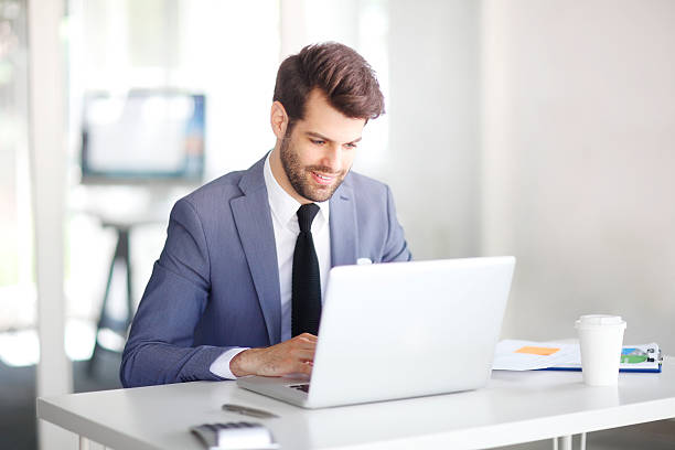 istock Businessman with laptop 576933442