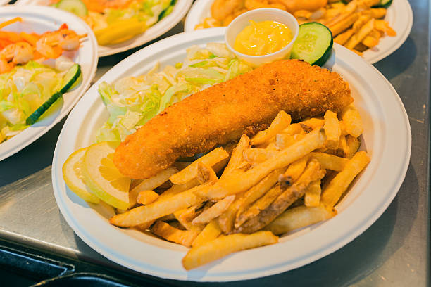 istock Street food: potatoes, seafood delicacies and salad 576933772