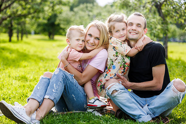 istock Family playing in the park 576933854