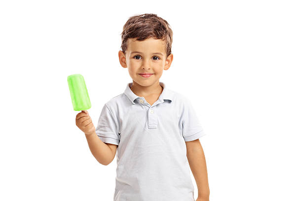 Little kid holding a green popsicle