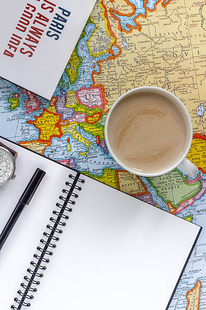 istock Planning vacation trip with map and Giudebook. 576935324