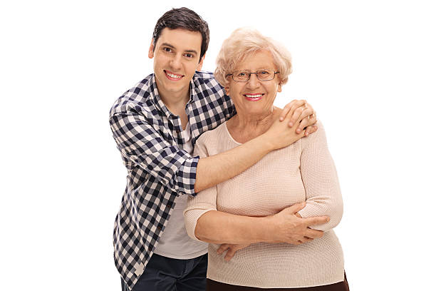 Young man hugging a senior lady