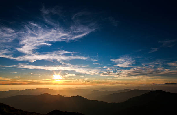 istock Magnificent sunset sky over silhouette of the mountains 576936586