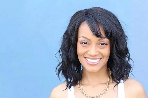 Photo of Laughing African American woman with an wavy hairstyle