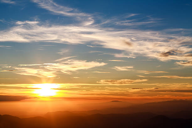 istock Magnificent sunset sky over silhouette of the mountains 576936942
