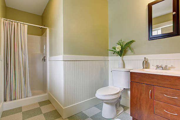istock Light bathroom interior design with brown cabinet 576937296