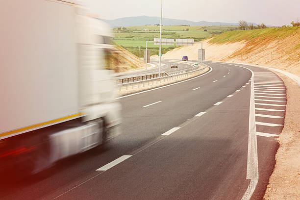 istock Blurred truck on a highway 576938018