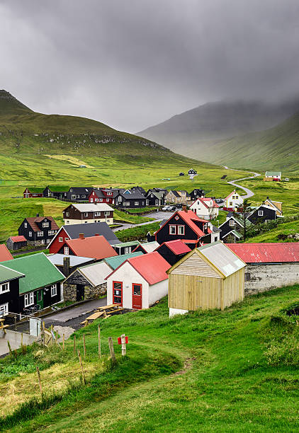 Gjogv, Faroe Islands, Denmark Picturesque village of Gjogv with typically colourful houses on the island of Eysturoy, Faroe Islands, Denmark green valley denmark stock pictures, royalty-free photos & images