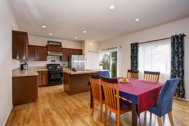 istock Bright kitchen and dining room interior with colorful curtains 576938466