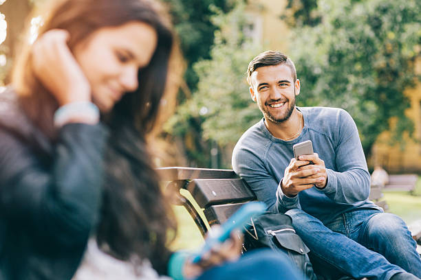 istock Girl and boy flirting 576938674