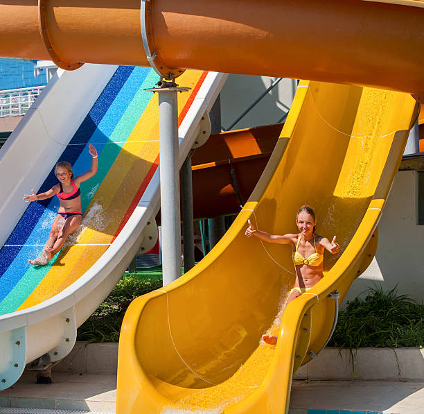 istock Children on water slide at aquapark. 577302616
