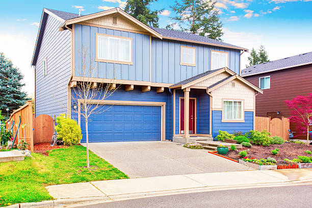 istock Nice curb appeal of blue house with front garden 577302814