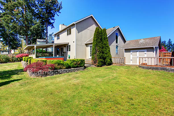 istock Back yard house exterior with covered patio area 577303566
