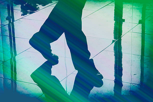 shadow of male feet on floor background.