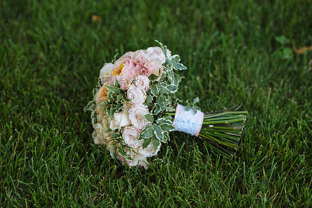 istock Wedding bouquet on green grass. Bride's flowers 577304962