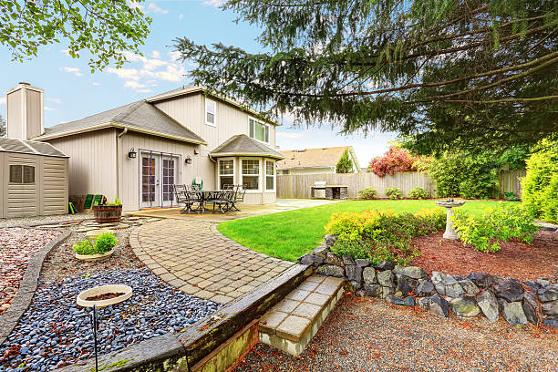 istock Cozy patio area with concrete floor and table set. 577305510