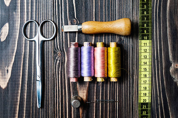 istock Accessories for sewing on dark wooden table 577306924