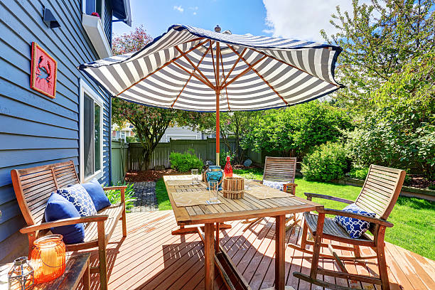 istock Wooden walkout deck in the backyard garden 577307146