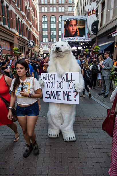 Person in Bear Costume at RNC 2016 Convention Cleveland OH, USA - July 17, 2016: RNC 2016 Person in Bear costume at 2016 RNC that says WhatWill You Do To Save Me hillary clinton stock pictures, royalty-free photos & images