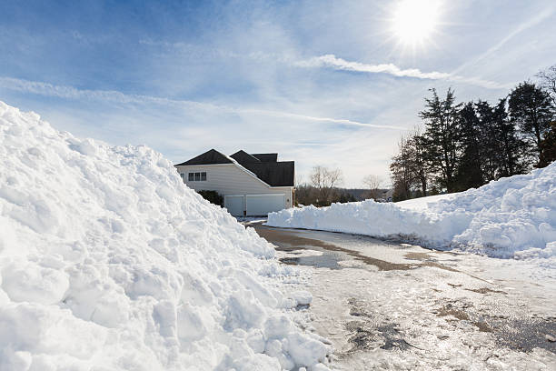 istock Deep drifts by side of driveway to modern home 577309150