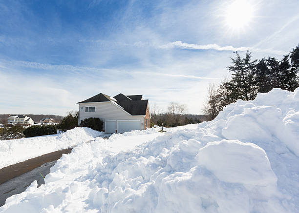 istock Deep drifts by side of driveway to modern home 577309184
