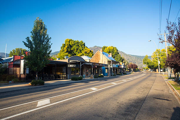 Bright Main Street The country town of Bright early on a cool autumn morning along the Great Alpine Rd in Victoria, Australia victoria australia photos stock pictures, royalty-free photos & images