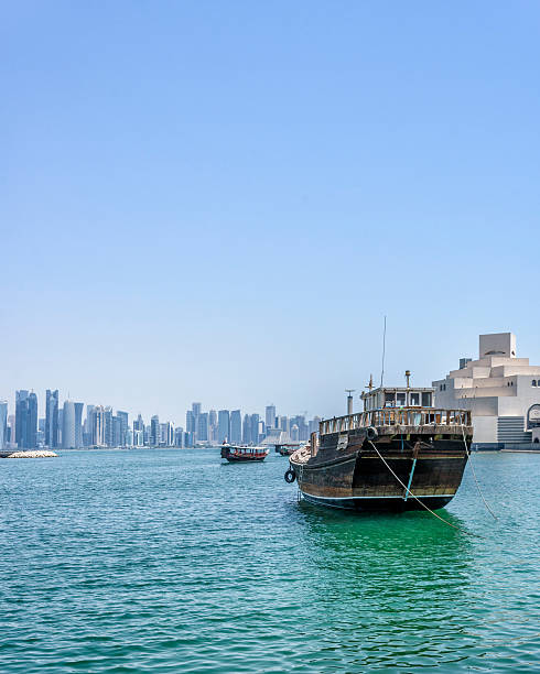 istock Dhow boat at ancor in front of Doha skyline 577312032
