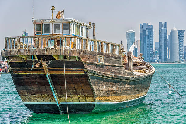 istock Dhow boat at ancor in front of Doha skyline 577312318