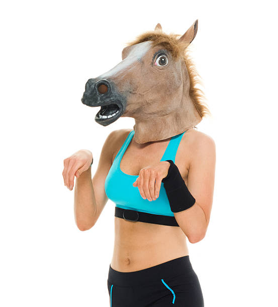 istock Female runner acting like horse 577315018