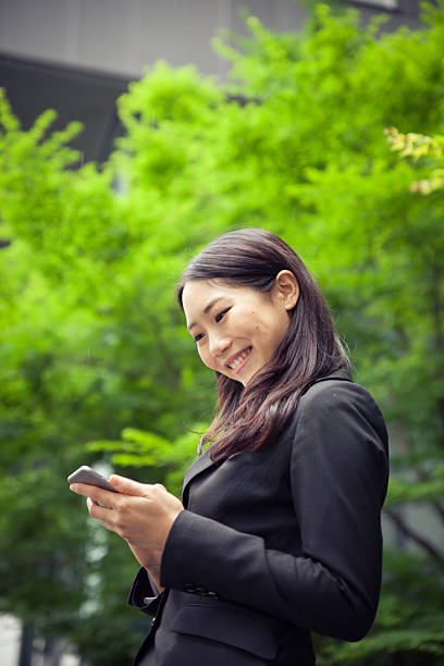 istock Modern Businesswoman working on her smart phone 577317406