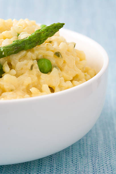 istock Risotto with asparagus, parsley and peas 577317516