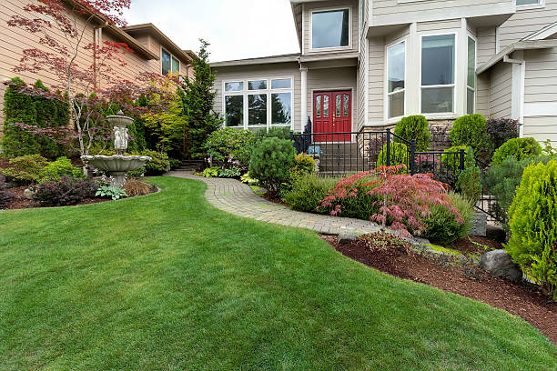 Frontyard of House with Water Fountain Frontyard garden of house with water fountain green grass lawn paver brick path trees and shrubs landscaping hardscape photos stock pictures, royalty-free photos & images