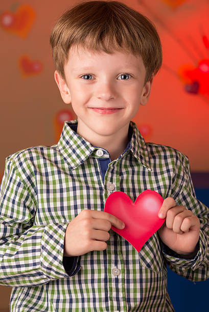 istock Boy with a heart in his hands 577319484