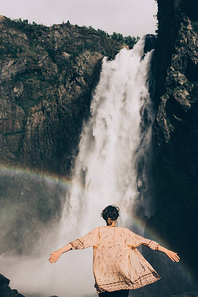 istock Woman near the waterfall 577321206