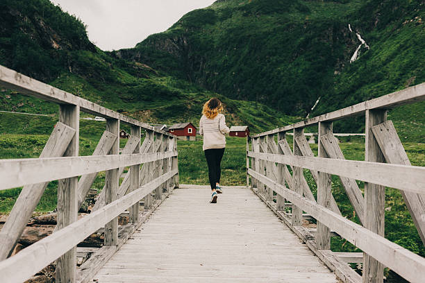 istock Woman running on the bridge 577322458