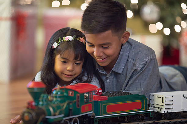 istock Playing with a New Christmas Train 577324560