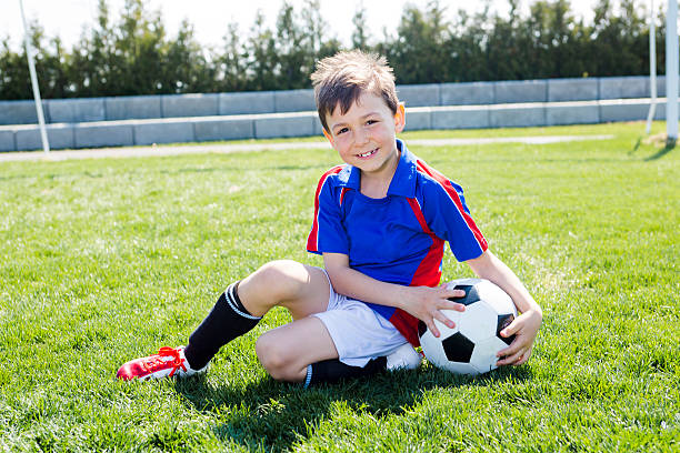 istock handsome teenager boy Football 577324712