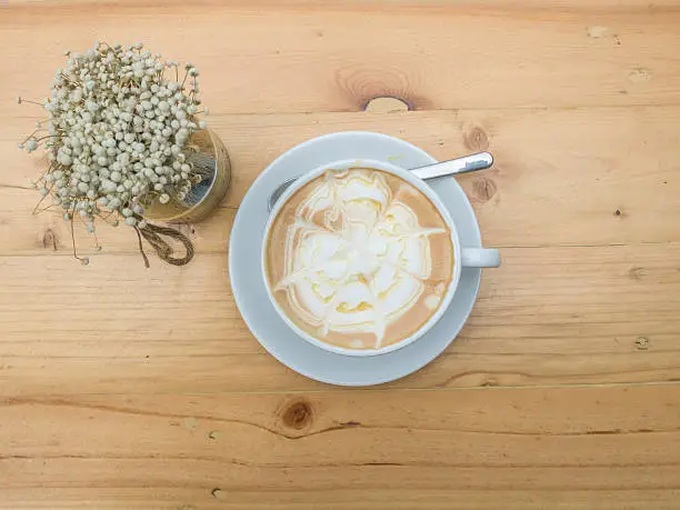 Photo of Close up cup of Coffee, latte on the wooden table