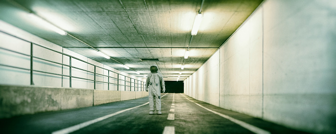 Lost astronaut in underground passage.
